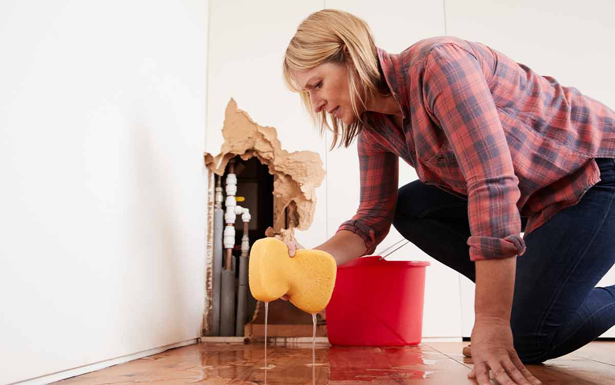 lady picking up water damage in her home in west palm beach